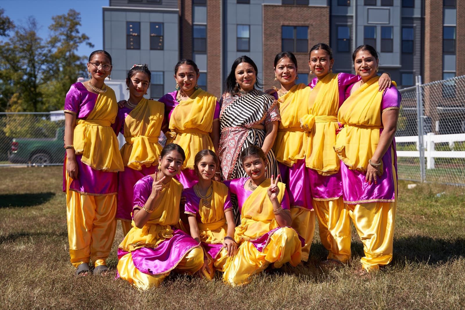 Dancers in yellow and magenta